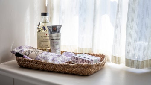 A selection of lavender scented toiletries displayed in a shallow basket from the 2025 autumn/winter collection
